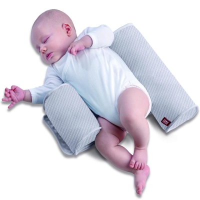 Особенности подушки позиционера для сна новорождённого: отличия по видам